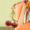 Quadafy 18K Gold Cherry Keychain, Cherry Bag Charm Made of Glitter Resin